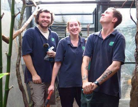 Three Living Rainforest staff members smiling together, Newbury
